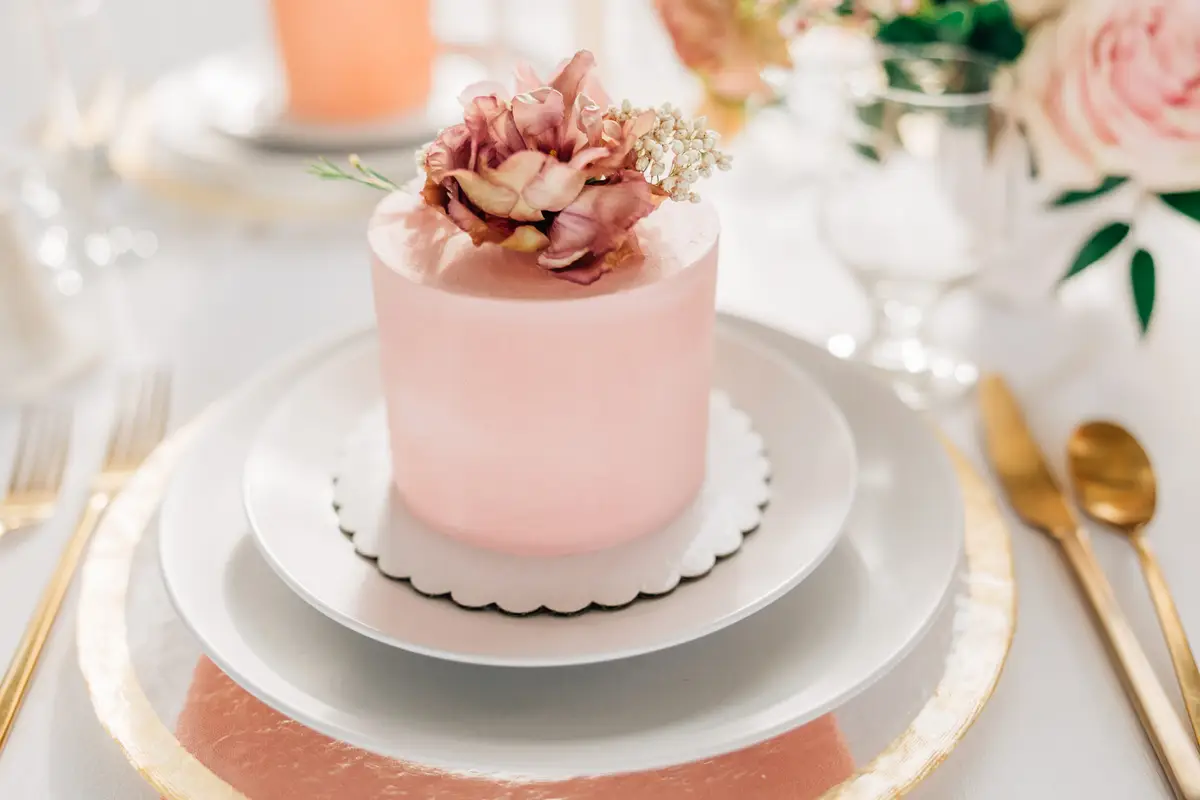 Wedding cake prices from $150: blush single-tier wedding cake with a garden rose by Sweet E's Bakery, Utah