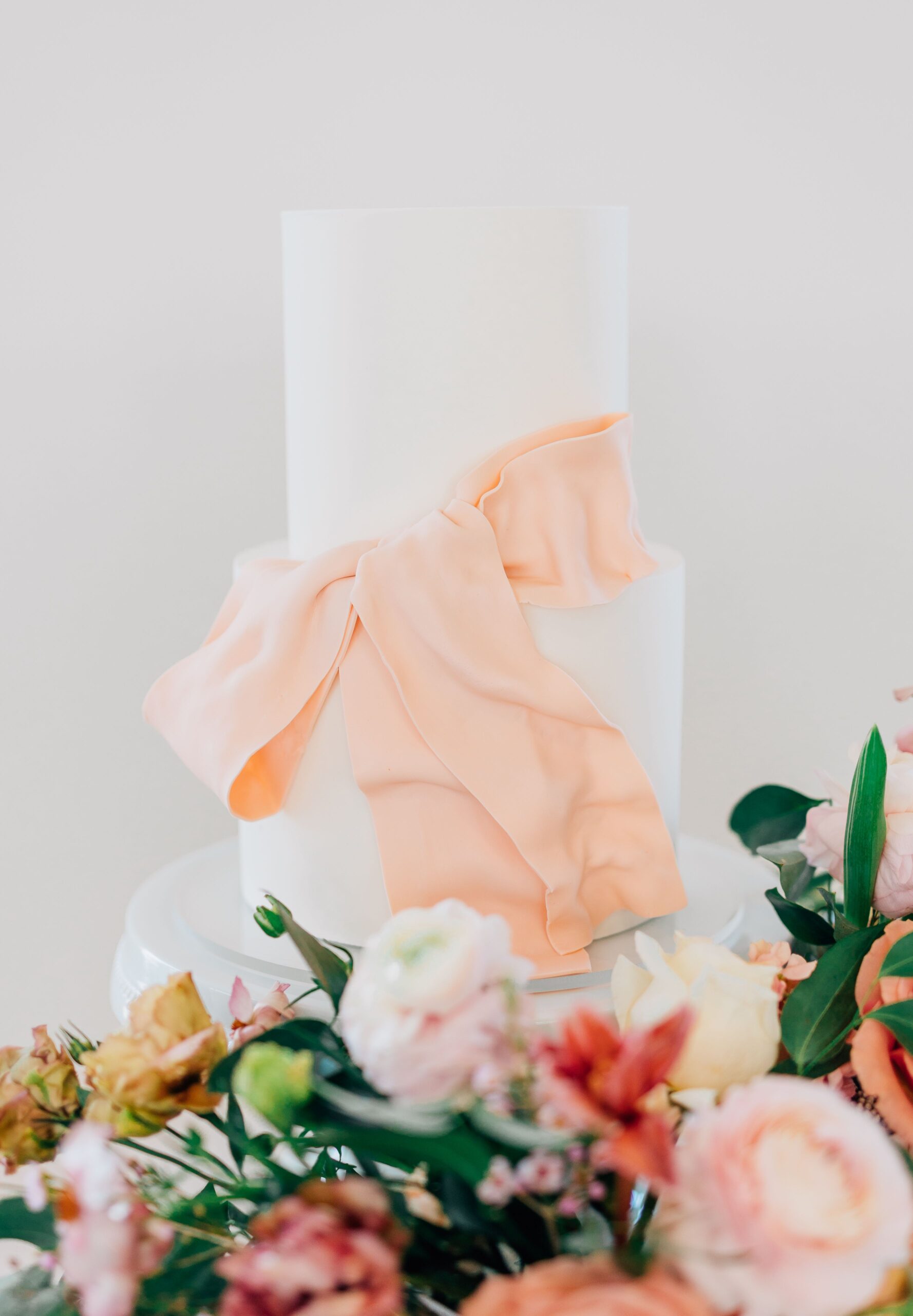 Statement wedding cake with draped fondant bow by Sweet E's Bakery, Utah
