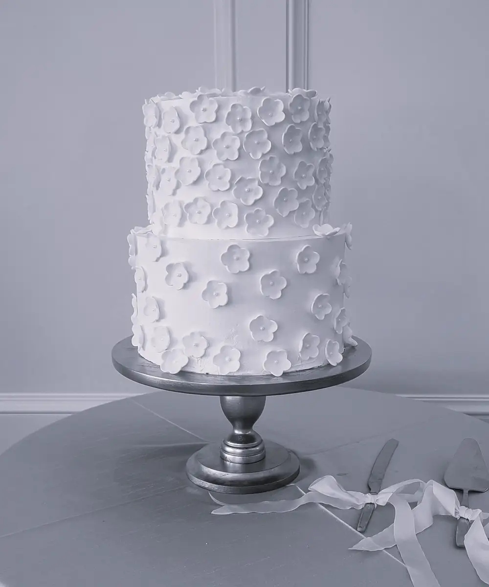 Buttercream wedding cake with florals by Sweet E's