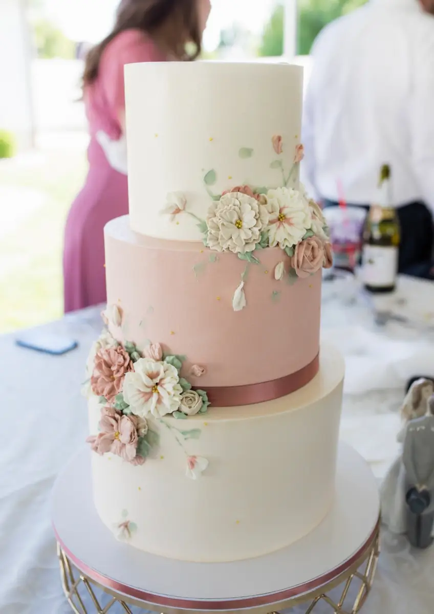 Buttercream wedding cake with florals by Sweet E's
