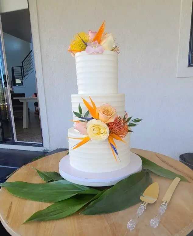 Buttercream wedding cake with florals by Sweet E's