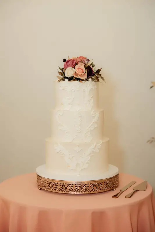 Buttercream wedding cake with florals by Sweet E's