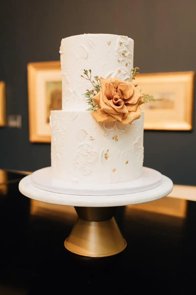 Buttercream wedding cake with florals by Sweet E's