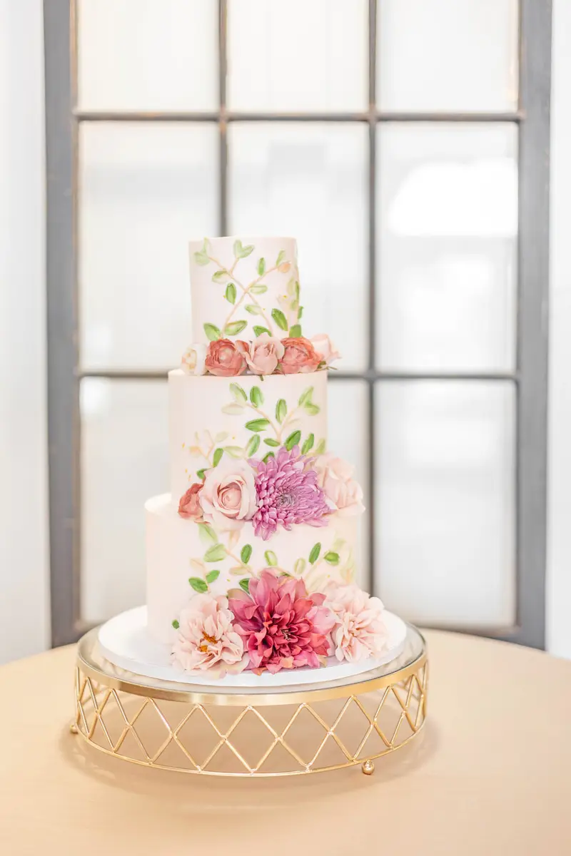 Buttercream wedding cake with florals by Sweet E's