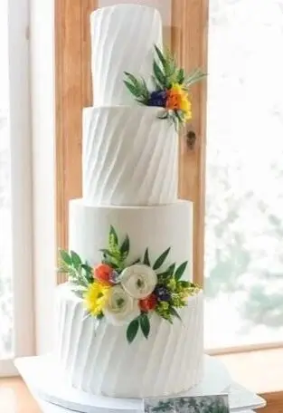 Buttercream wedding cake with florals by Sweet E's