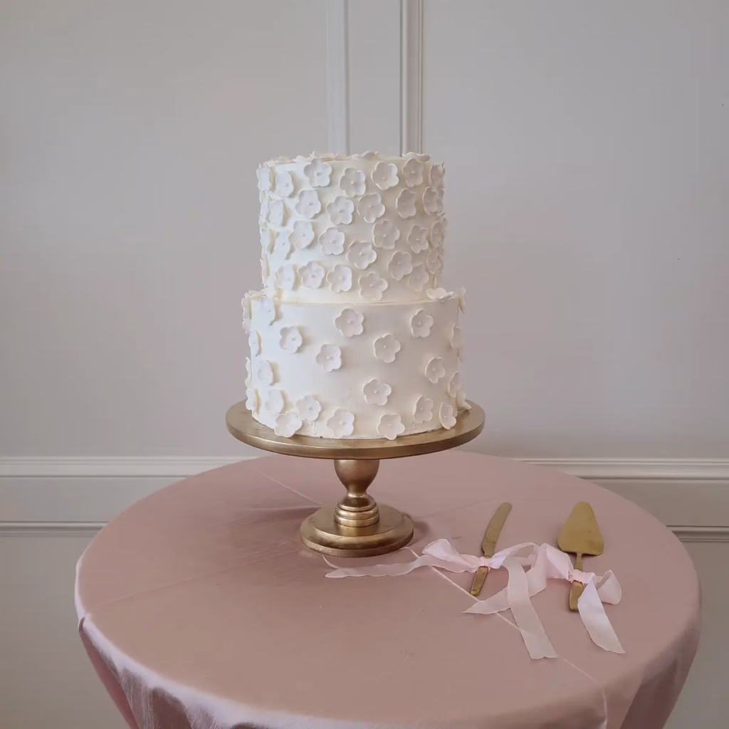 Classic all-white tiered wedding cake by Sweet E's Bakery, Utah